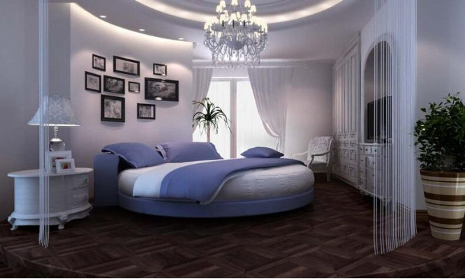 Letto rotondo nero con design moderno, dettagli eleganti e divano letto