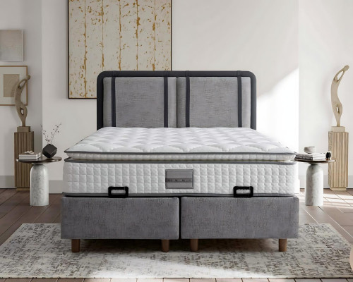Il letto elegante e stabile con materasso porta charme nell'arredamento.