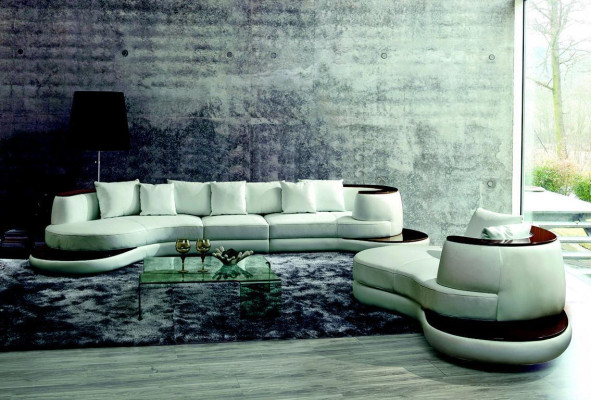 Moderno set di divani angolari in pelle per divano imbottito a isola rotonda.