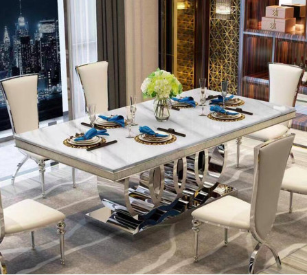 Tavolo da pranzo di lusso in metallo dorato per sala da pranzo.