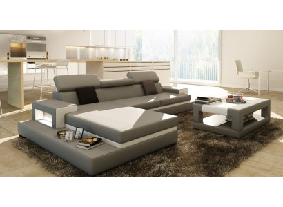 Divano angolare imbottito in tessuto e pelle per arredamento salotto.