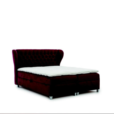 Lussuoso letto boxspring matrimoniale in legno con testiera imbottita dal design moderno.
