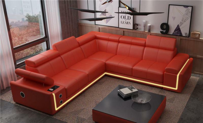 Divano ad angolo in pelle illuminata a forma di L con casse audio LED moderne.