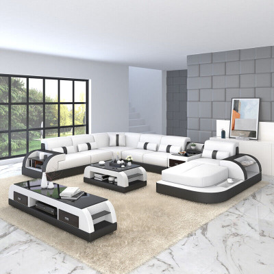 Divano a forma di U in pelle di design per il soggiorno con divano ad angolo e cuscini.