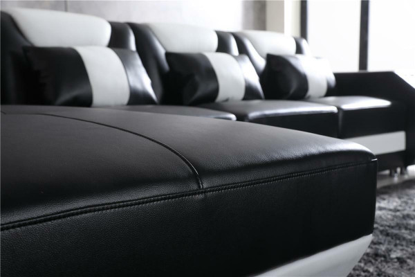 Divano a forma di L per il relax con illuminazione, per arredare il soggiorno.