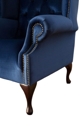 Poltrona Chesterfield in tessuto blu di lusso per lounge con rivestimento in tessuto.