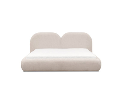 Camera da letto beige con letto matrimoniale, testiera rotonda in tessuto, letti imbottiti nuovi.