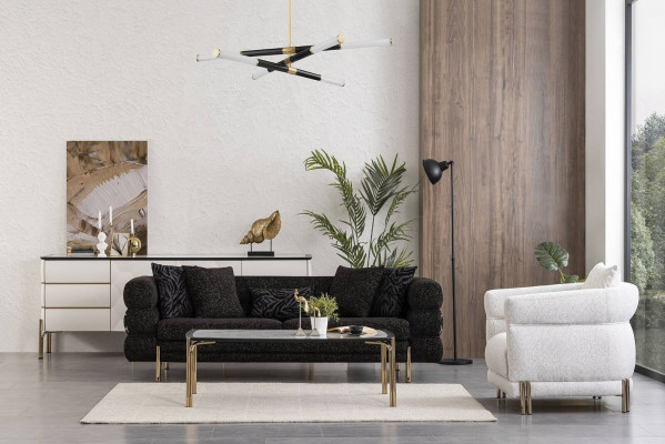 Set da salotto con divano designer nero di lusso, poltrona bianca a tre posti.