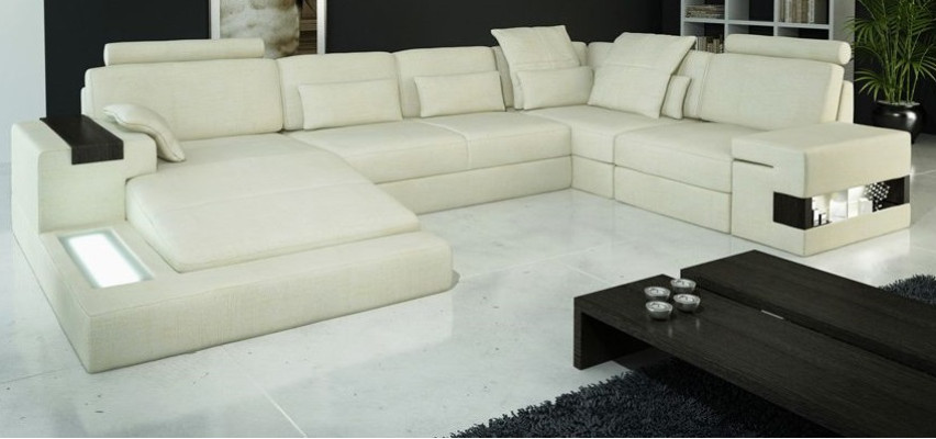 Divano ad angolo a forma di U con design imbottito in tessuto nuovo con funzione letto.