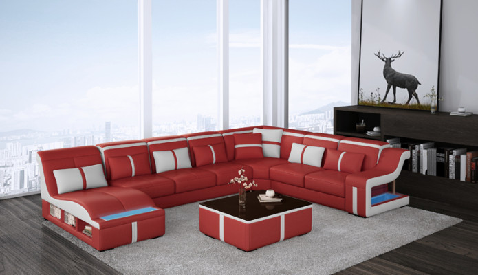 Divano ad angolo imbottito a forma di L in pelle per arredamento.