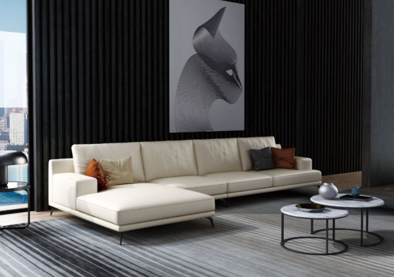 Garnitura divano design angolare con pouf imbottito.