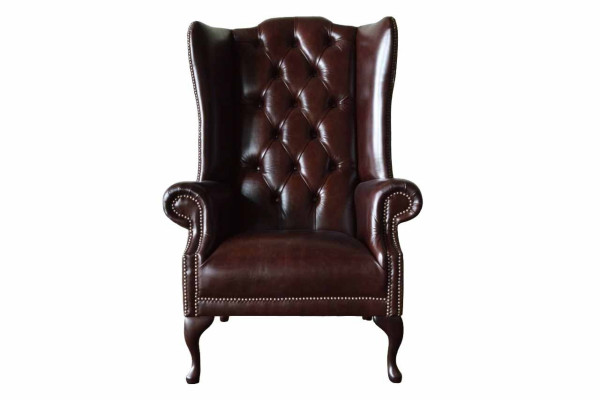 Poltrona monoposto marrone in pelle design Chesterfield per soggiorno.