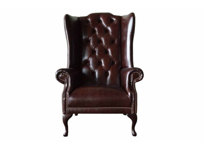 Poltrona monoposto marrone in pelle design Chesterfield per soggiorno.