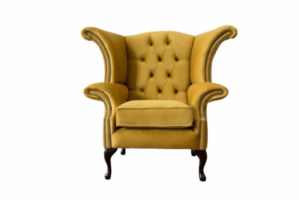 Poltrona gialla con braccioli design Chesterfield in tessuto di lusso