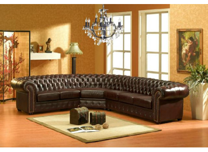 Classico divano d'angolo Chesterfield in pelle con imbottitura.