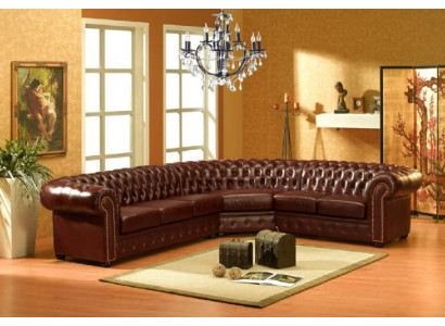 Classico divano d'angolo Chesterfield in pelle con imbottitura.