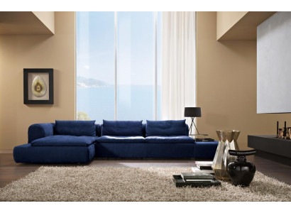 Divano angolare a L blu in tessuto per divani imbottiti.