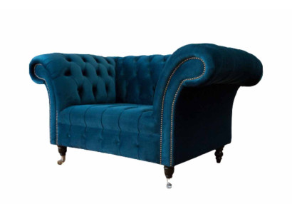 Chesterfield poltrona design divano blu in tessuto.