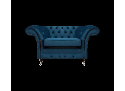 Poltrona Chesterfield di lusso in tessuto blu per il soggiorno.