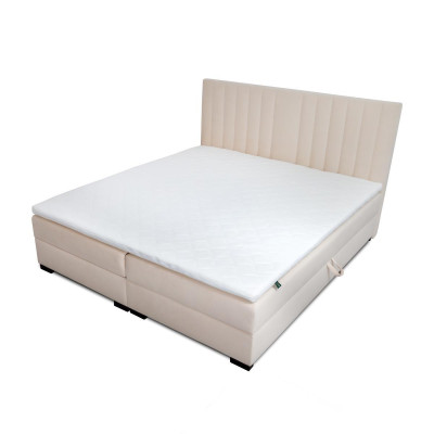 Un letto confortevole e funzionale è realizzato con materiali di alta qualità in stile moderno.