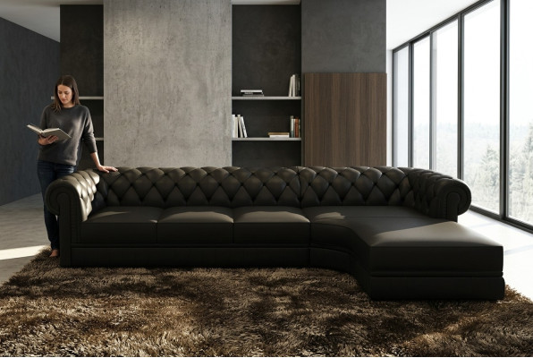 Classico set di divani Chesterfield in pelle ad angolo con imbottitura.