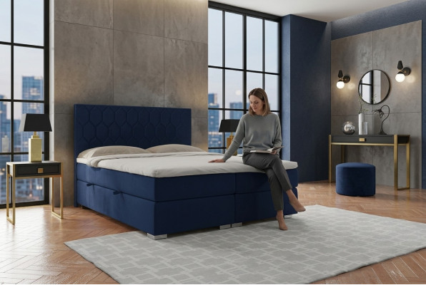 Letto boxspring Design dell'hotel in velluto di lusso con funzione di scrigno imbottito.