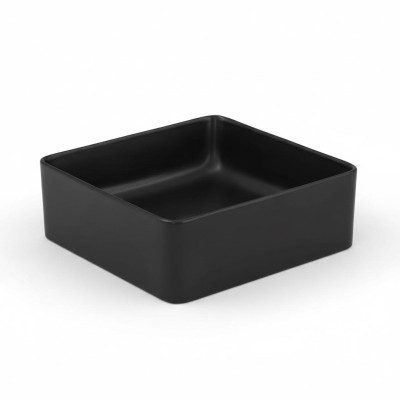 Lavabo in ceramica nera da appoggio con piano tavolo per lavandino.