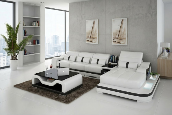 Divano a L in tessuto con funzione letto e design in pelle o tessuto.