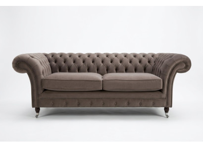 Divano Chesterfield in velluto di lusso a tre posti per il soggiorno.