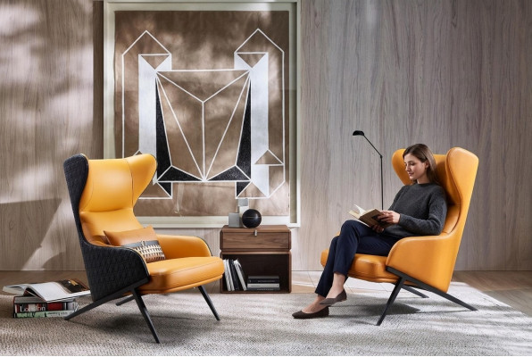 Poltrona design da relax per lounge club, singola, imbottita in tessuto o pelle.