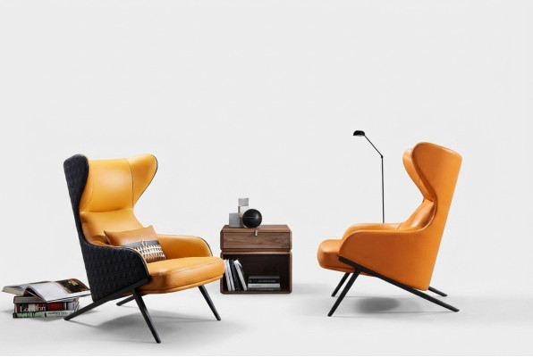 Poltrona design da relax per lounge club, singola, imbottita in tessuto o pelle.