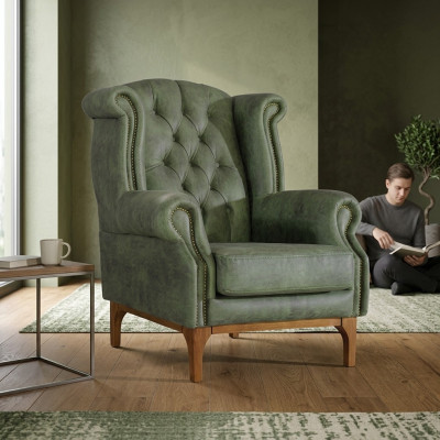 Grüner Chesterfield Luxury Armchair, Designer Armchair in Italian is Sedia Chesterfield di lusso verde, poltrona da designer con braccioli.