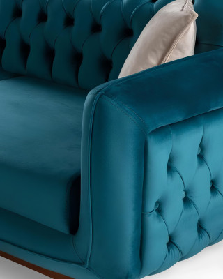 Divano design a 3 posti in tessuto turchese.