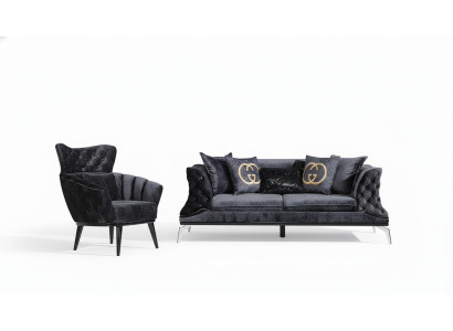 Divano nero Chesterfield a tre posti più uno per il salotto.