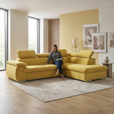 Divano angolare design a L con funzione letto imbottito in tessuto.