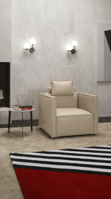 Poltrona monoposto, sedile imbottito, design in tessuto, seduta in pelle moderna grigia.