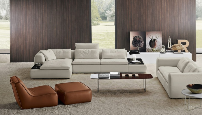 Divano angolare ad L in pelle di lusso per il soggiorno con divano imbottito dal design.