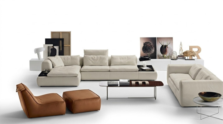 Divano angolare ad L in pelle di lusso per il soggiorno con divano imbottito dal design.