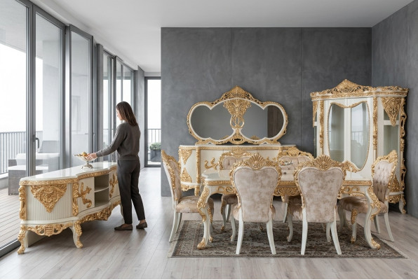 Magnifico set completo di mobili per sala da pranzo con abbondanti elementi decorativi.