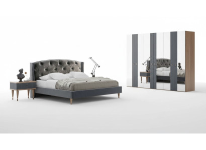Set da camera da letto Chesterfield moderno con letto matrimoniale design e comodini.