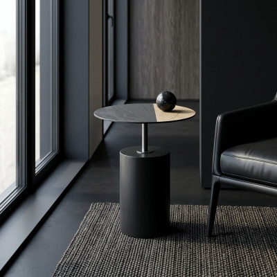 Tavolino design rotondo da salotto in legno nero.