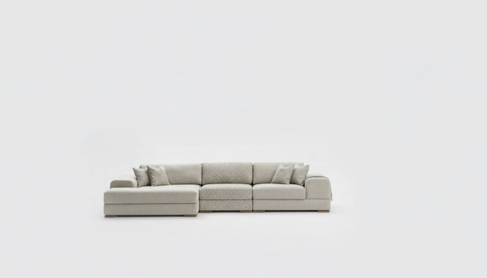 Divano angolare a L in stile moderno grigio, lussuoso, da salotto.