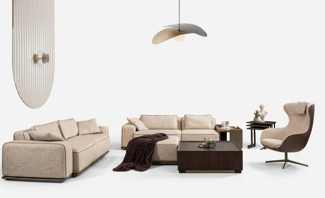 Set di divani tre posti in tessuto beige.