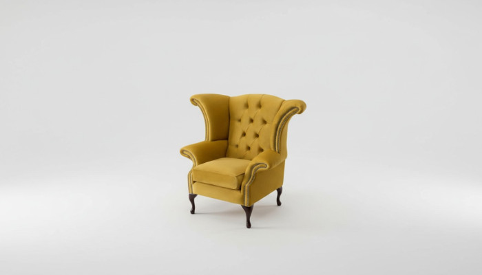 Poltrona gialla con braccioli design Chesterfield in tessuto di lusso