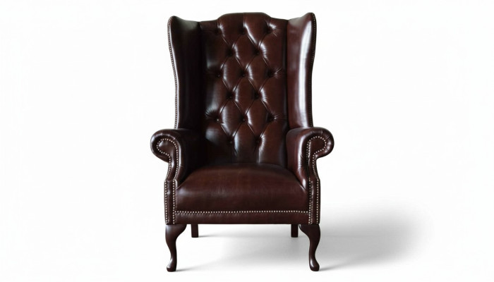 Poltrona monoposto marrone in pelle design Chesterfield per soggiorno.