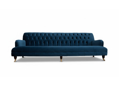 Sofà design di lusso in stile Chesterfield con quattro posti a sedere nel colore blu.