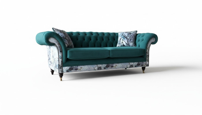 Un vivace divano Chesterfield a tre posti in un delicato colore smeraldo con motivo floreale