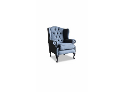 Poltrona da lounge di lusso in tessuto a un posto con design a sedile alto.