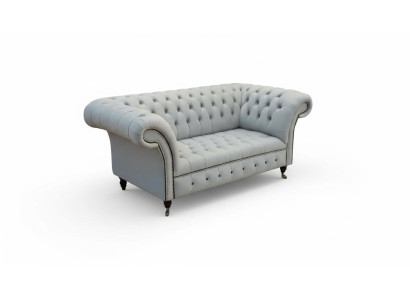Divano Chesterfield imbottito due posti grigio in pelle.