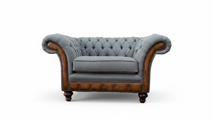 Poltrona design relax in tessuto lounge di lusso grigia imbottita Chesterfield.